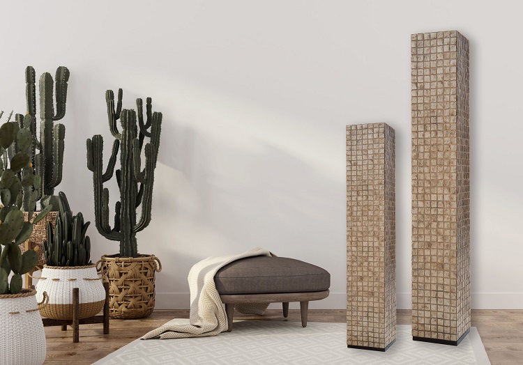 Boho-style interior with leather pouf and cacti